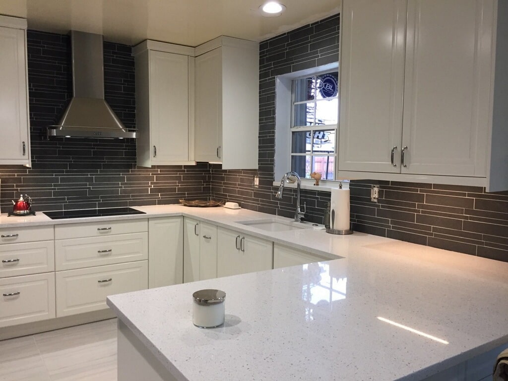 Norstone Ash Grey Lynia Interlocking Tile on a backsplash tile with LED under cabinet lighting